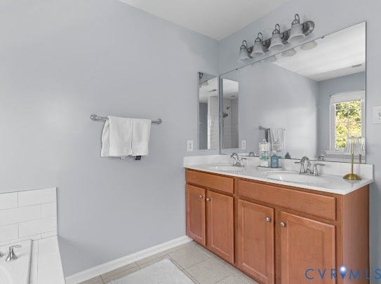 Dual vanity with wood-finish cabinetry and chrome hardware