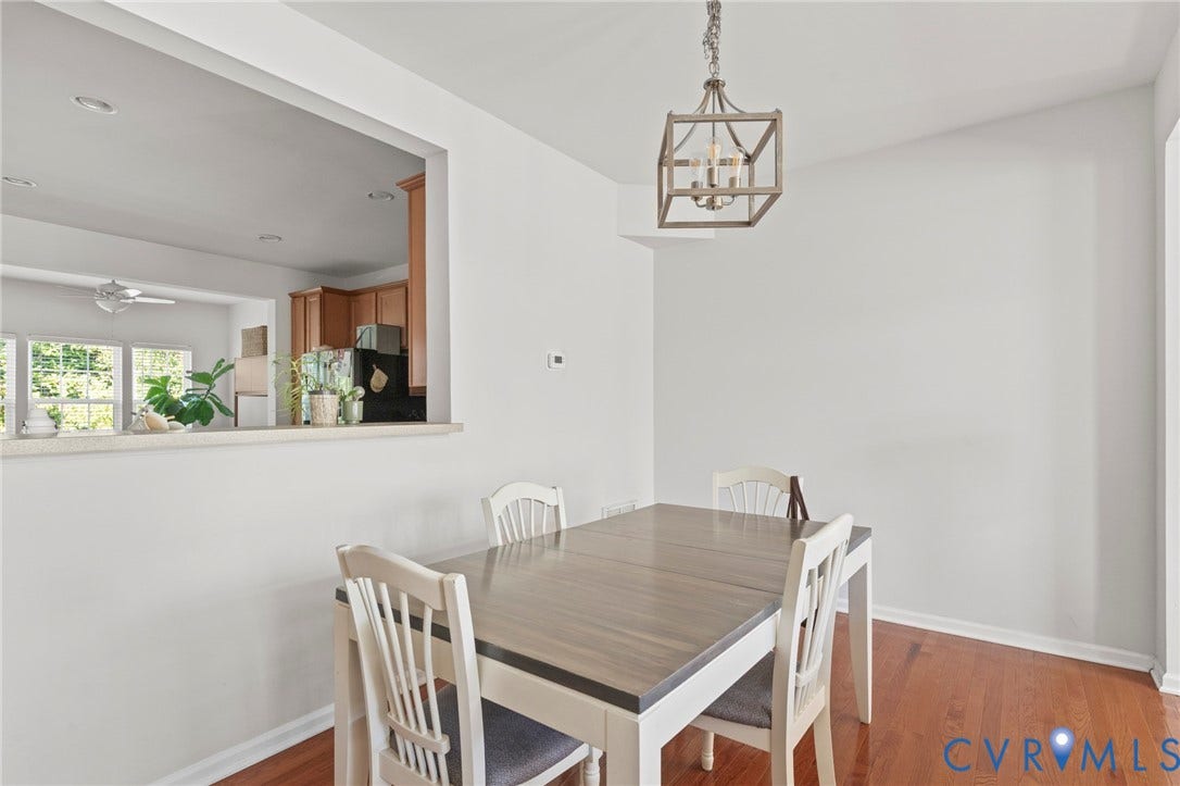 Wood-finish flooring with a decorative hanging light fixture