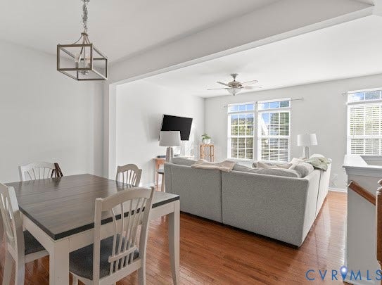 Hardwood flooring, recessed lighting, and a contemporary ceiling fan