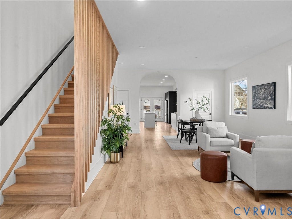 2202 3rd Avenue, Northside, Richmond, VA 23222 Wood-finish flooring throughout, light wood staircase with a slatted banister, and an arched doorway