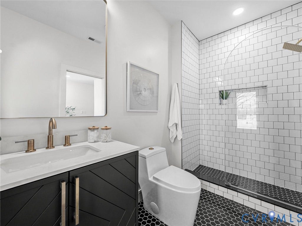 2202 3rd Avenue, Northside, Richmond, VA 23222 Vanity with a basin sink, wall-mounted mirror, and bronze-finish fixtures