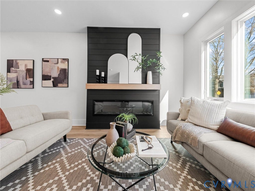 2202 3rd Avenue, Northside, Richmond, VA 23222 Recessed lighting, wood-finish flooring, black shiplap fireplace surround, built-in linear electric fireplace, and large windows