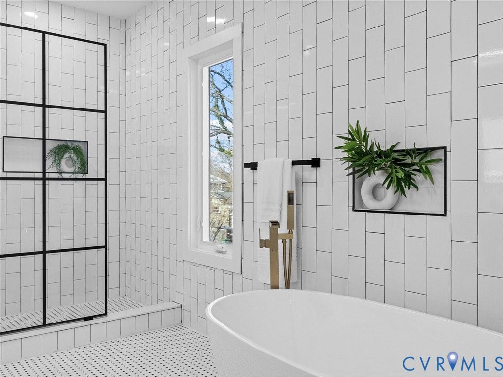 2202 3rd Avenue, Northside, Richmond, VA 23222 Freestanding soaking tub, walk-in shower with black grid-patterned glass, white subway tile walls, built-in shower niche, and small hexagonal floor tiles