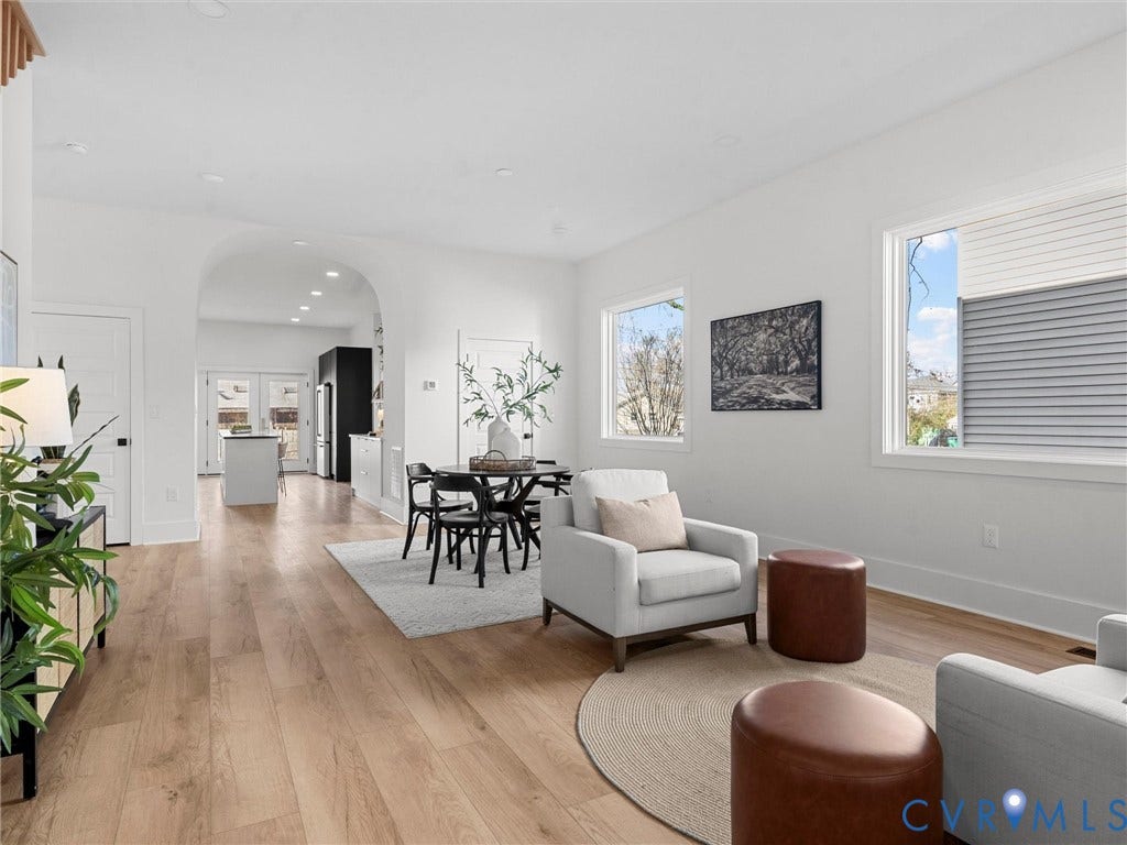 2202 3rd Avenue, Northside, Richmond, VA 23222 Open-concept living area featuring wood-finish flooring, an arched doorway, recessed lighting, and multiple windows