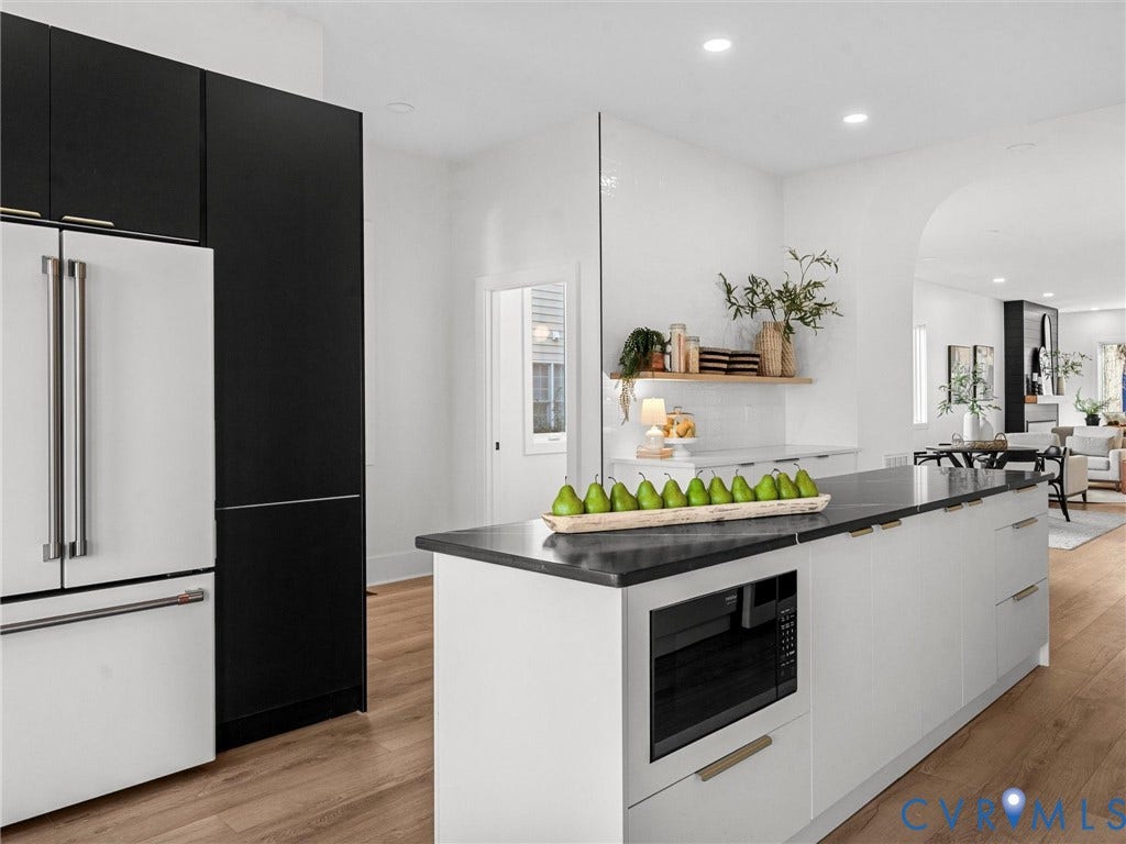 2202 3rd Avenue, Northside, Richmond, VA 23222 Kitchen featuring a built-in microwave, a two-tone refrigerator, wood-finish flooring, a kitchen island with a dark countertop, and recessed lighting