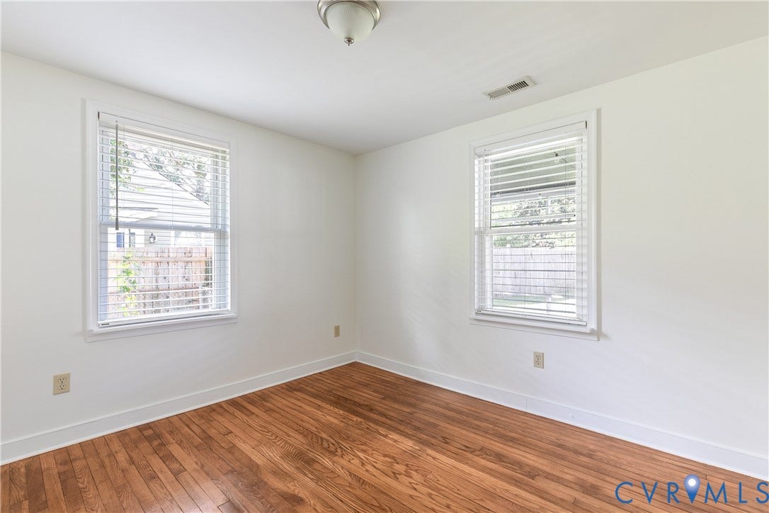 Bedroom #2, hardwood floors, light fixture, closet