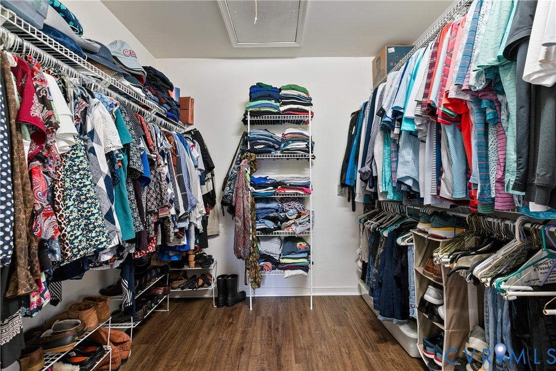Primary bedroom walk-in closet
