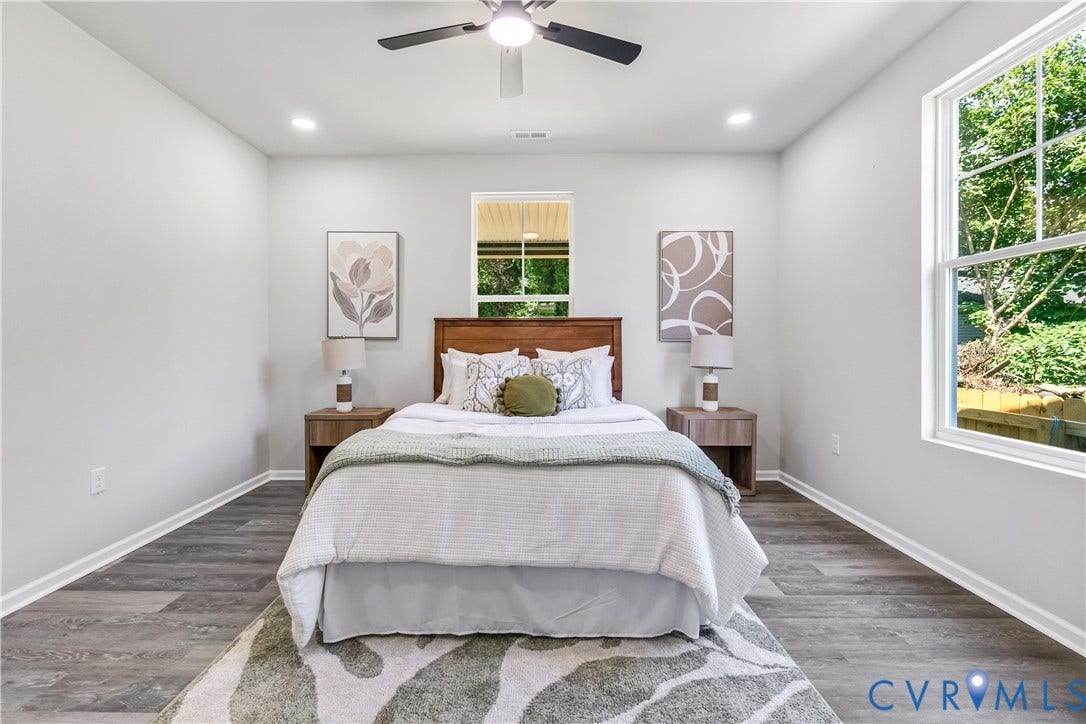 Recessed lighting, wood-finish flooring, ceiling fan, and multiple windows