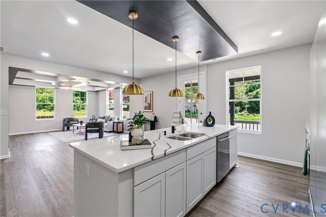 Kitchen island with quartz-finish countertop and undermount double sink