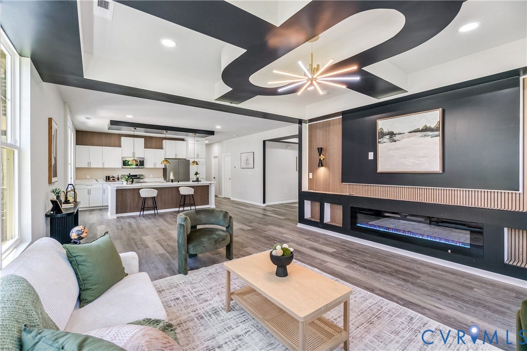 Open-concept living space with wood-finish flooring