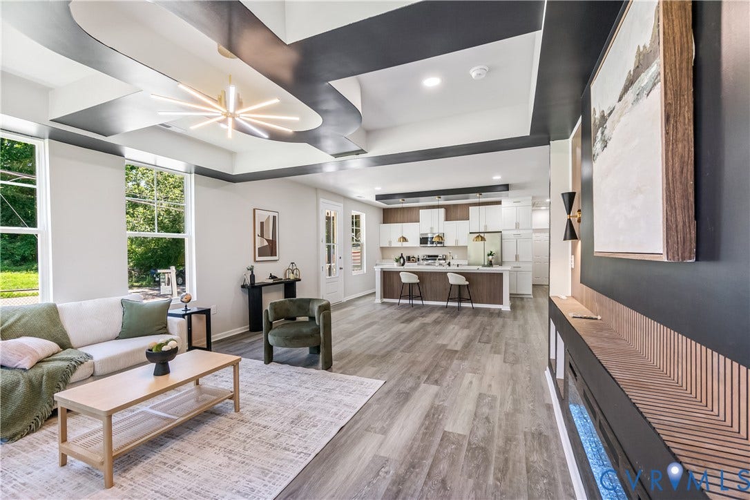 Recessed lighting and a decorative ceiling with accent trim