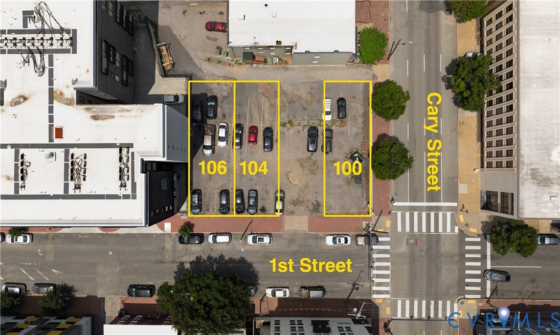 100, 104, & 106 S 1st Street, Richmond, VA 23219 Paved parking lot with designated spaces
