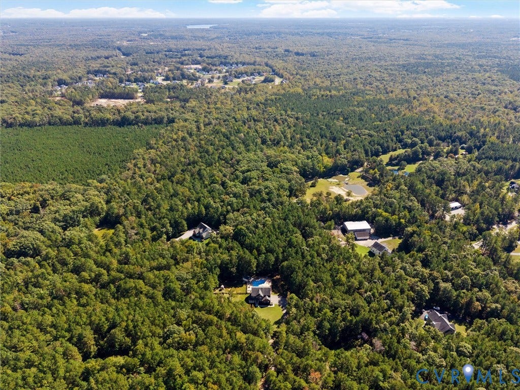 Expansive wooded landscape with scattered residential properties