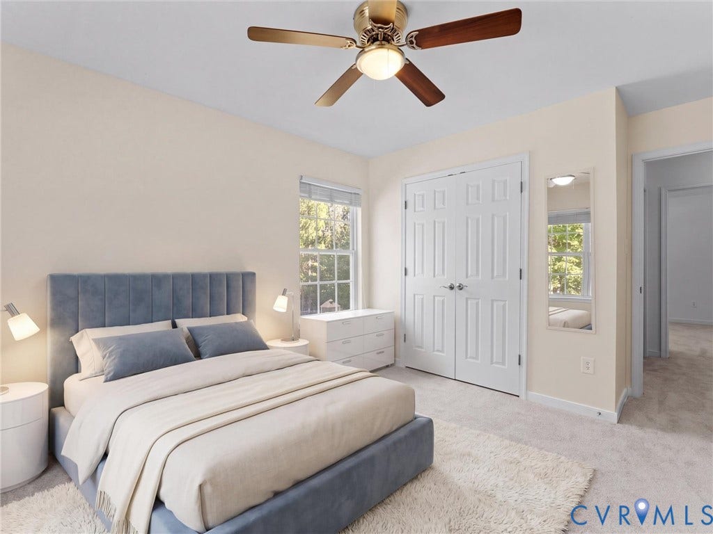 Wall-to-wall carpeting, double window, bi-fold closet doors, and overhead ceiling fan with lighting