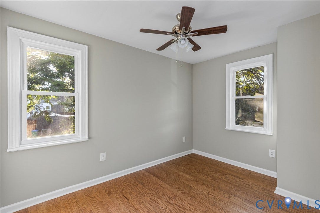 2606 Hawthorne Avenue, Richmond, VA 23222 Hardwood flooring, painted walls, ceiling fan, and two large windows