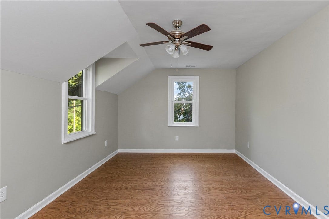 2606 Hawthorne Avenue, Richmond, VA 23222 Hardwood flooring, painted walls, sloped ceiling, window, and ceiling fan