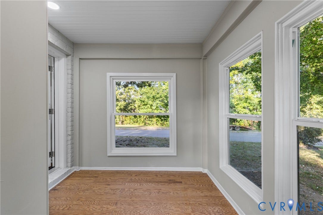 2606 Hawthorne Avenue, Richmond, VA 23222 Wood-finish flooring with white trim, multiple windows with white frames, and a white beadboard ceiling