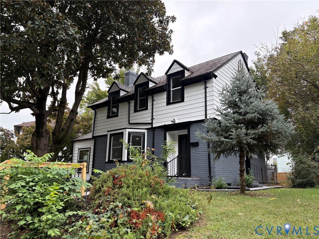 2606 Hawthorne Avenue, Richmond, VA 23222 Two-tone exterior with white siding and grey brick, multiple dormer windows, and a prominent bay window