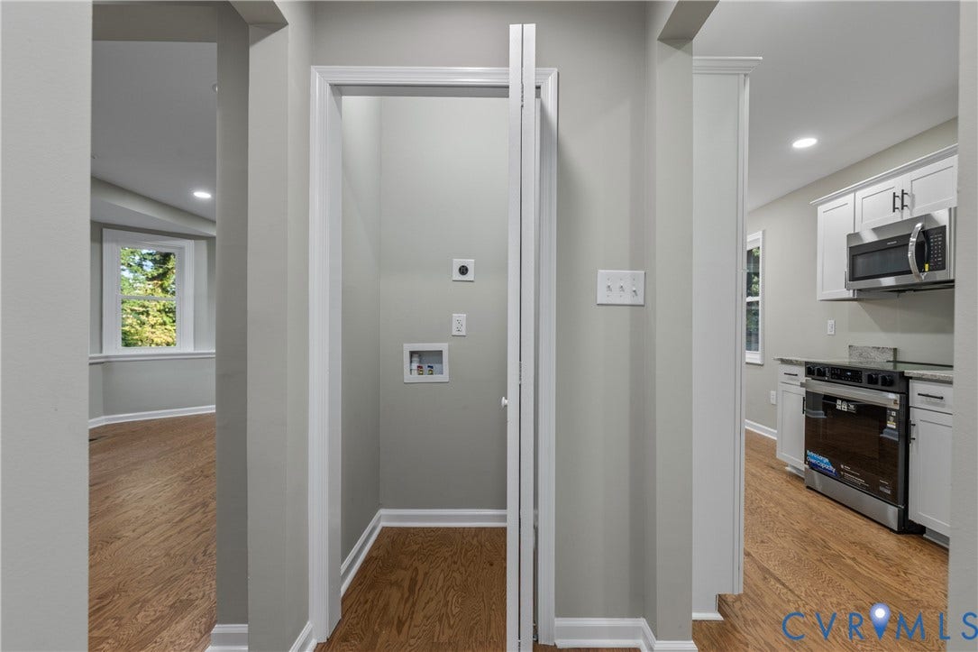 2606 Hawthorne Avenue, Richmond, VA 23222 Wood-finish flooring throughout, dedicated laundry utility area, recessed lighting, white cabinetry with dark hardware, and stainless steel kitchen appliances