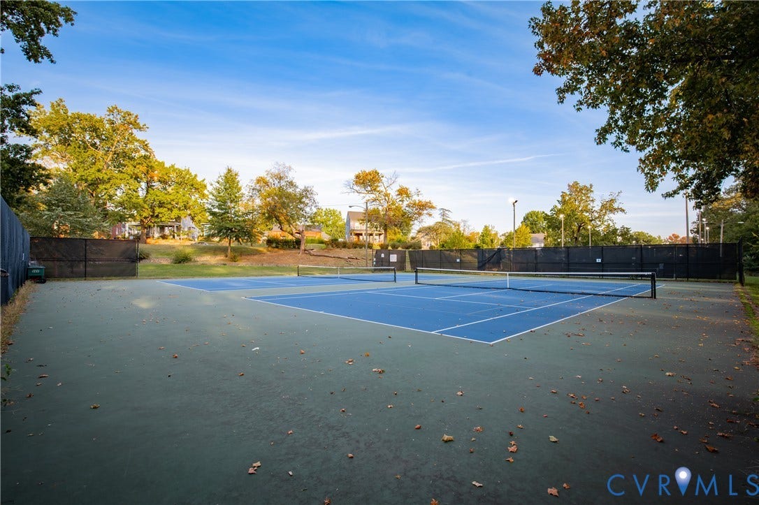 2606 Hawthorne Avenue, Richmond, VA 23222 Tennis court featuring a blue playing surface and black fencing