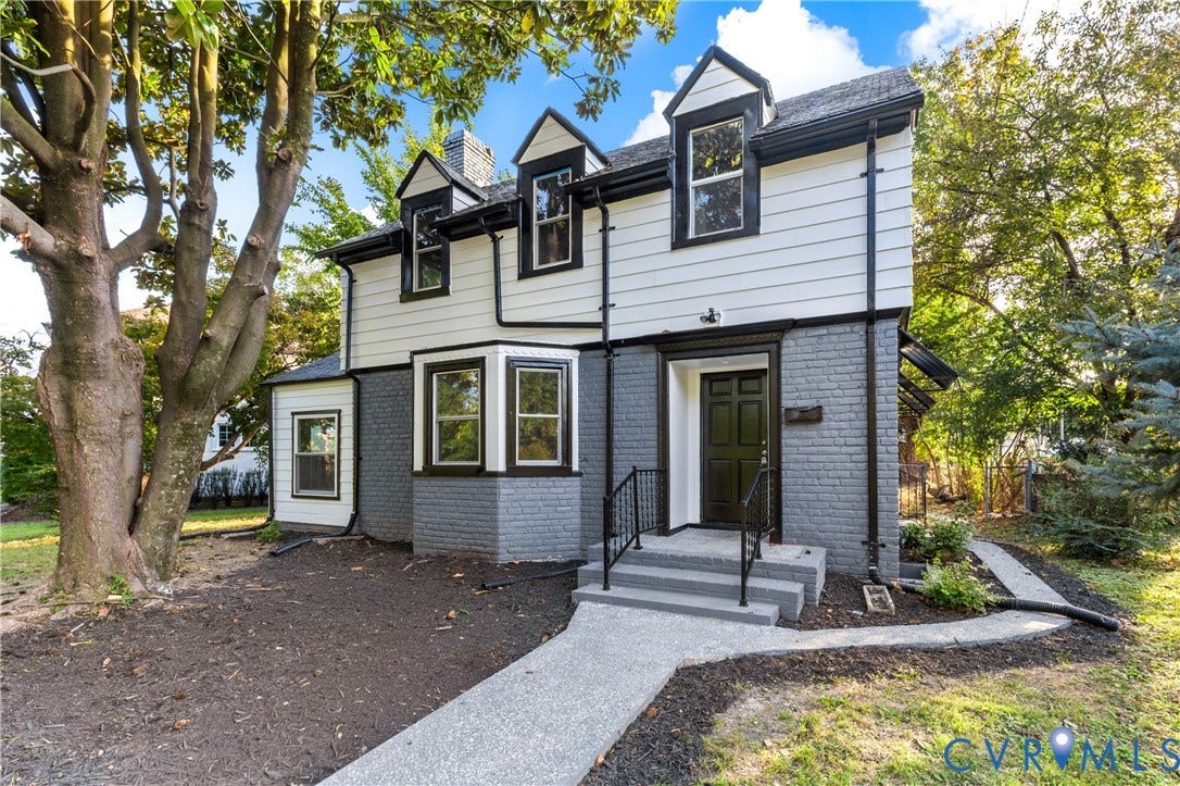 2606 Hawthorne Avenue, Richmond, VA 23222 Two-story exterior with white siding and gray brick, featuring a covered entry, bay window, and gabled dormers