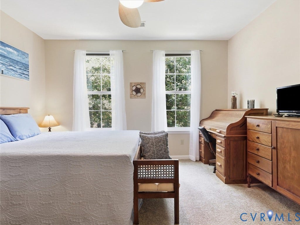 Neutral tone walls with an overhead ceiling fan