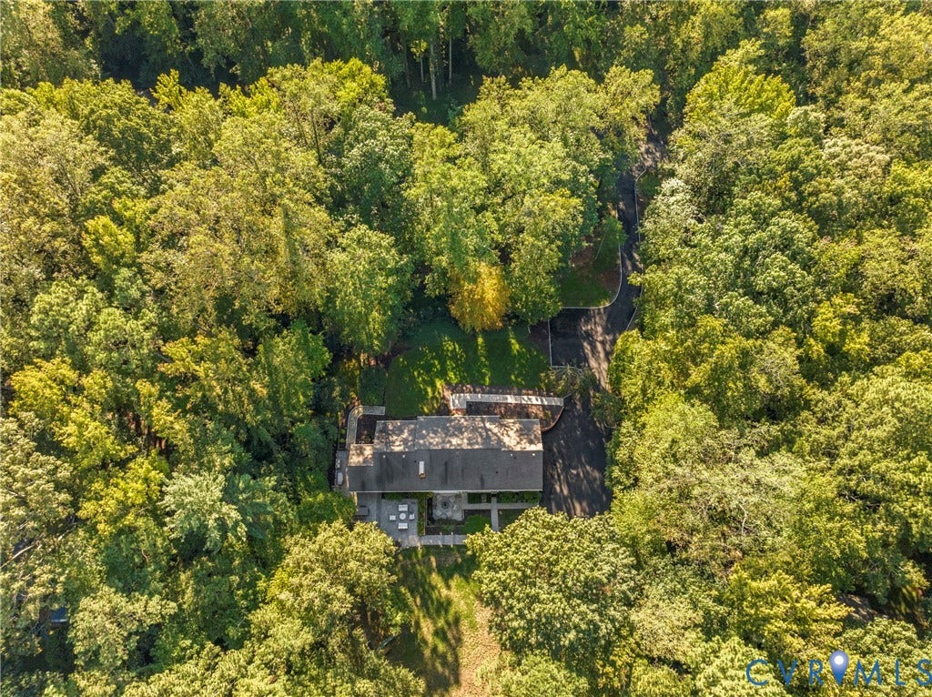 Wooded surroundings with a private driveway