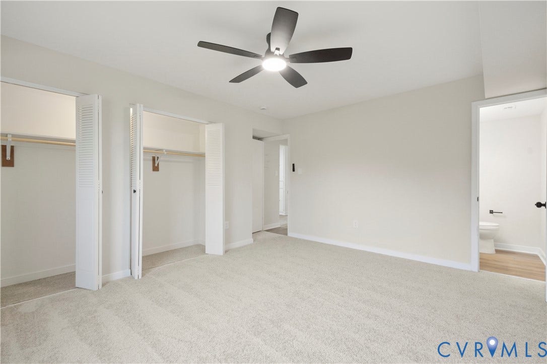 Recessed lighting, ceiling fan with light fixture, light-toned wall paint, carpeted flooring, and bi-fold closet doors