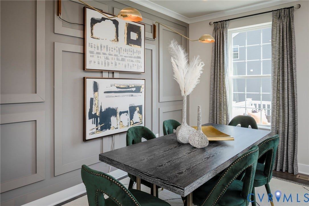 Decorative wall paneling, single window with white trim, wood-finish flooring, recessed lighting, and a linear wall-mounted light fixture