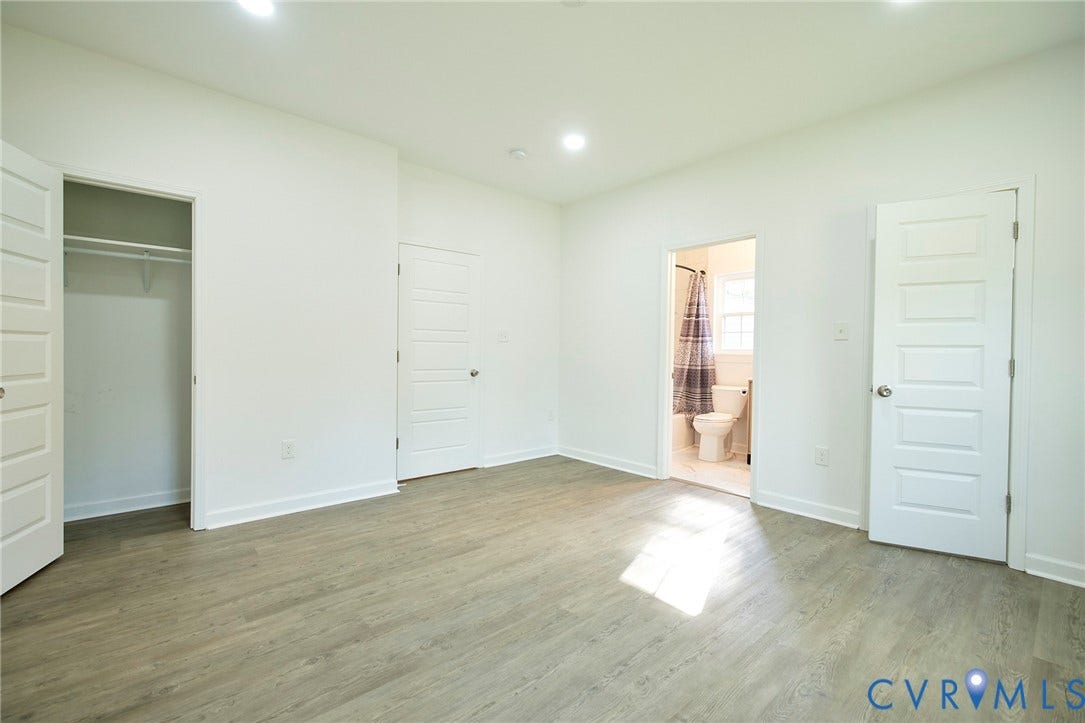 2421 Buena Vista Boulevard, Chester, VA 23831 Light wood-finish flooring, recessed lighting, white interior doors, and a closet with hanging rod