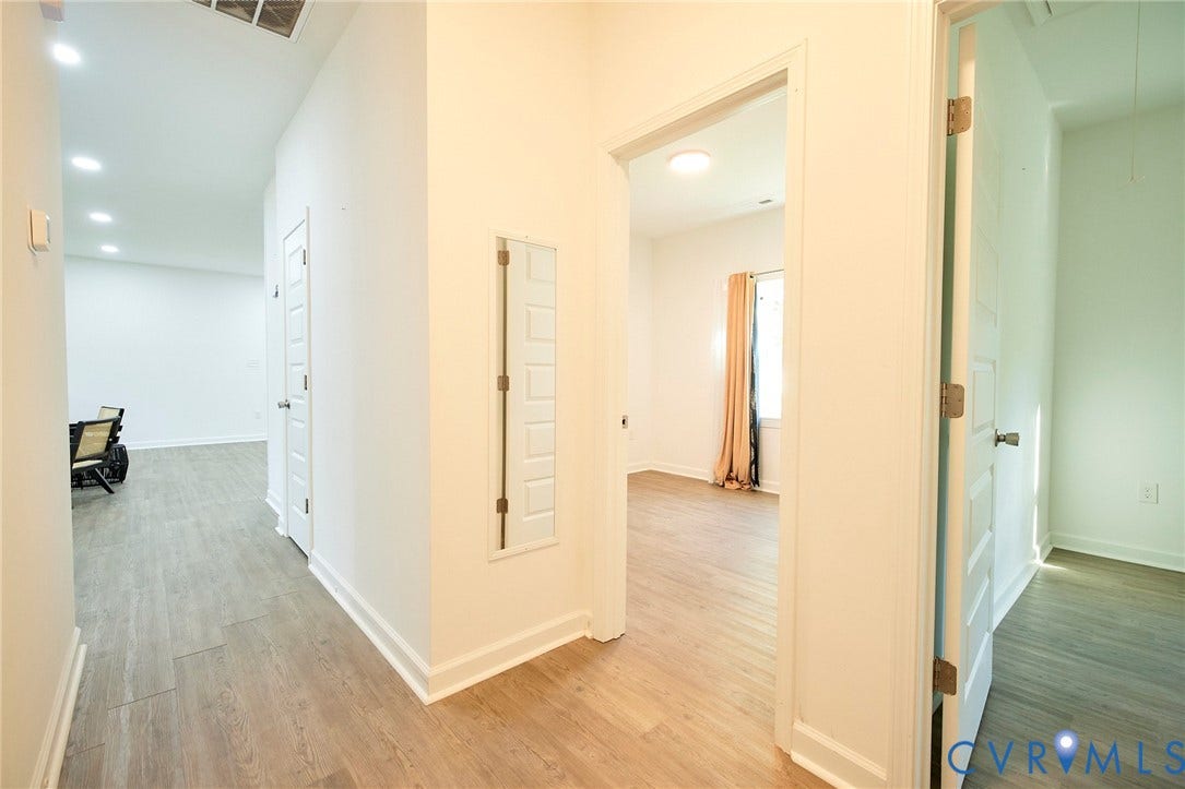 2421 Buena Vista Boulevard, Chester, VA 23831 Wood-finish flooring throughout, recessed lighting, and crisp white walls provide a bright interior