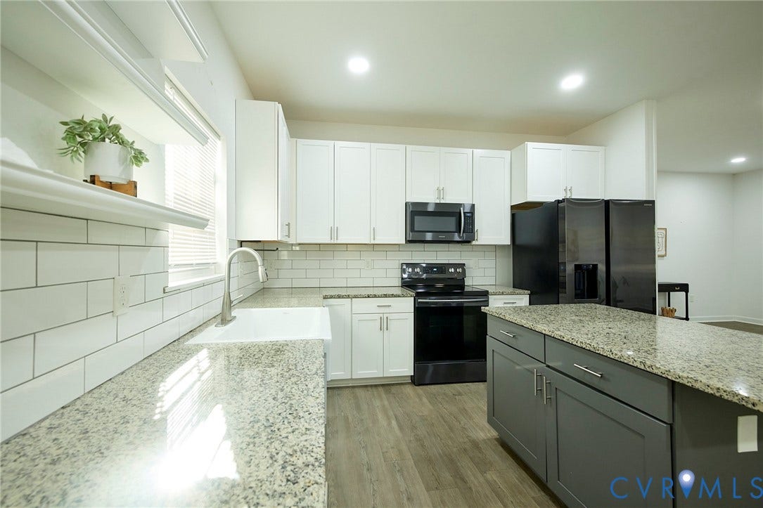 2421 Buena Vista Boulevard, Chester, VA 23831 Kitchen featuring granite-style countertops, white subway tile backsplash, white shaker-style cabinetry, and wood-finish flooring