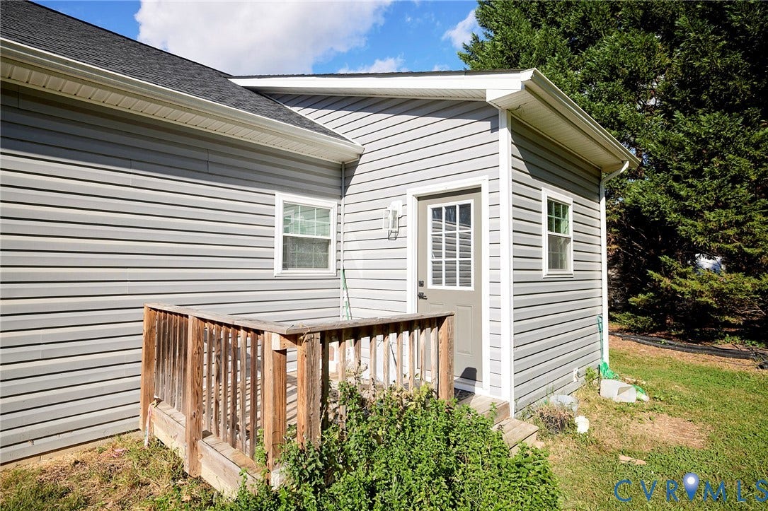 2421 Buena Vista Boulevard, Chester, VA 23831 White vinyl siding exterior with composite decking and wooden railings