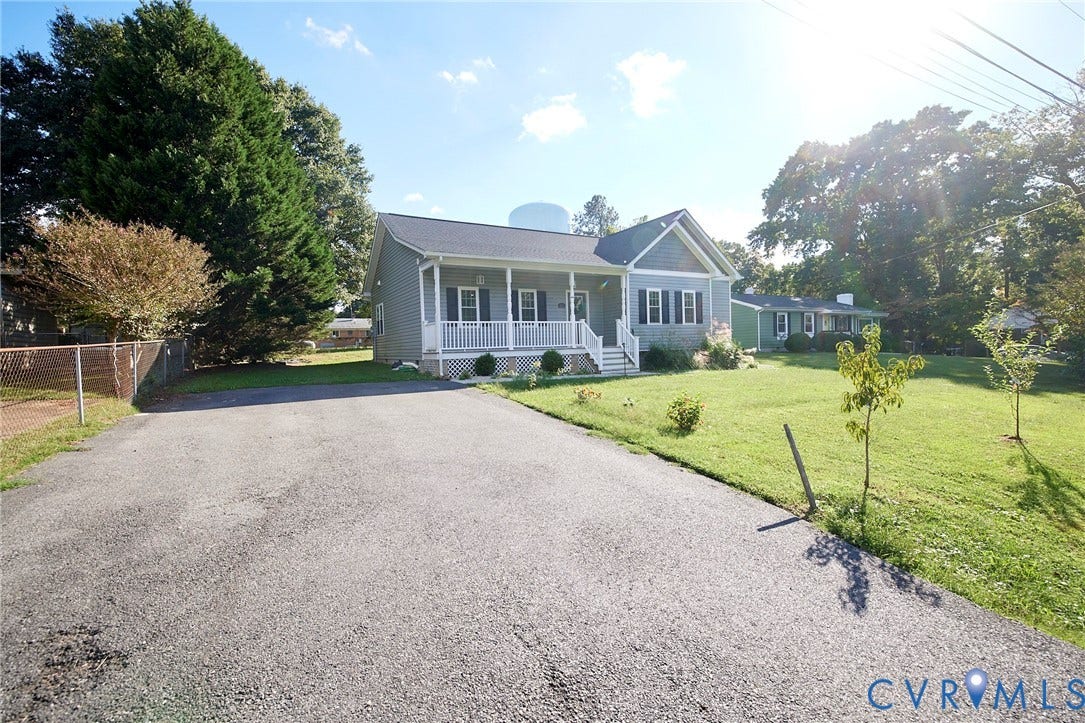 2421 Buena Vista Boulevard, Chester, VA 23831 Siding exterior with a covered front porch, white railing, and dark shutters