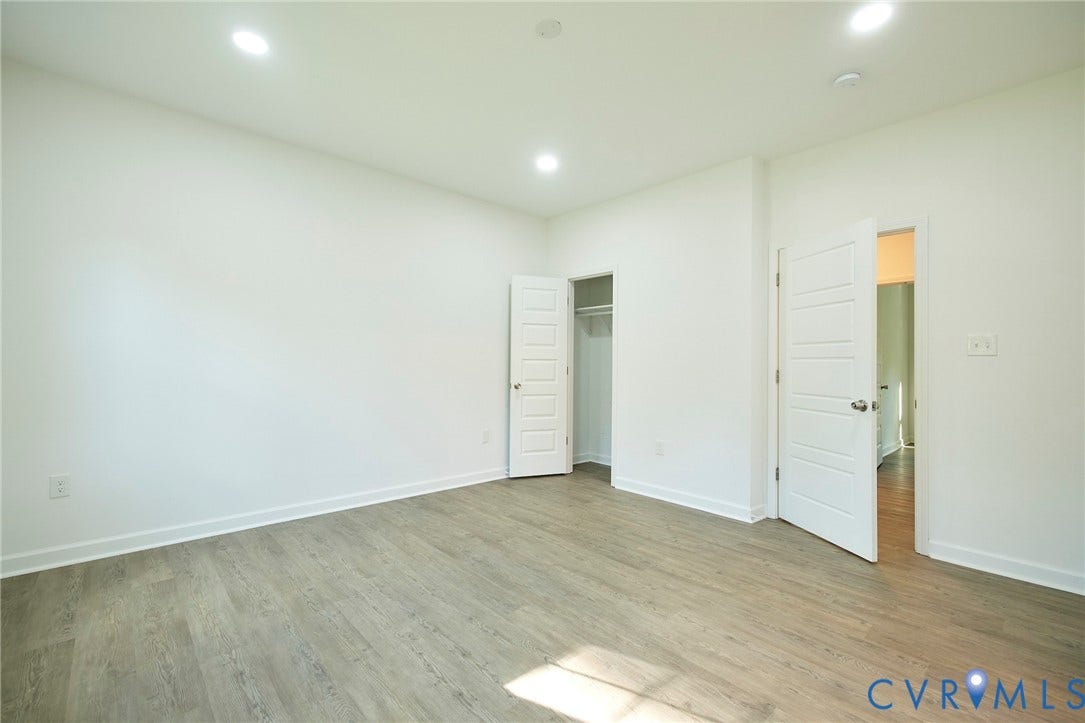 2421 Buena Vista Boulevard, Chester, VA 23831 Wood-finish flooring, recessed lighting, white walls, and a built-in closet with hanging rod