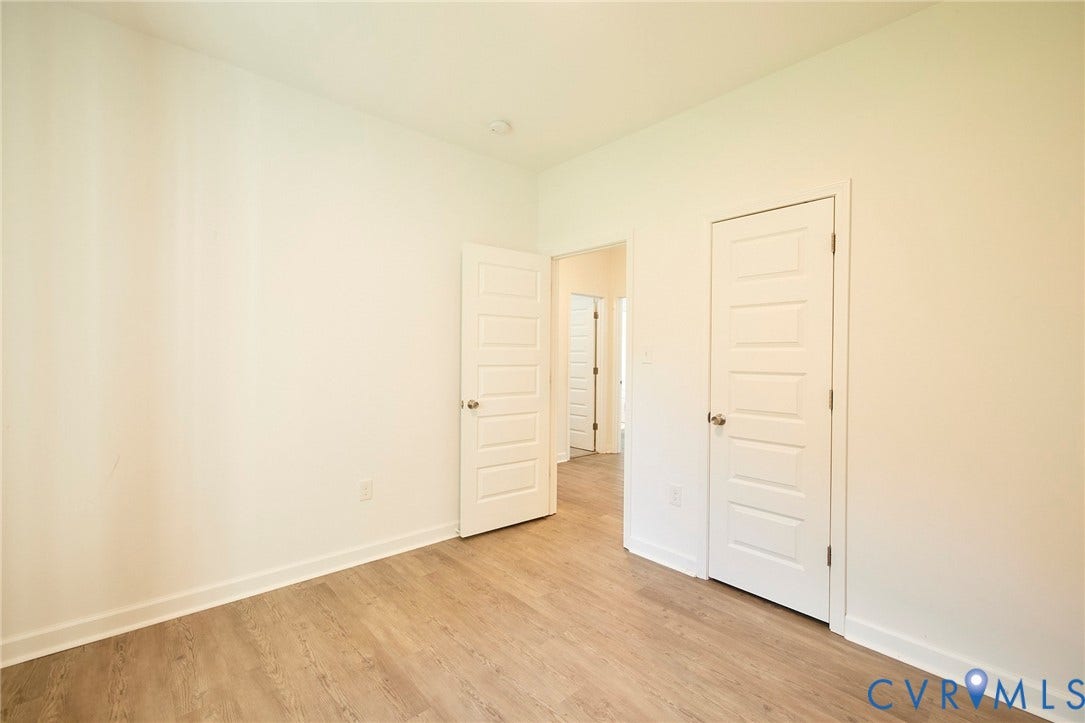 2421 Buena Vista Boulevard, Chester, VA 23831 Neutral white wall finishes, wood-finish flooring, and recessed ceiling lighting