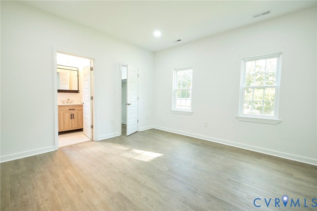 2421 Buena Vista Boulevard, Chester, VA 23831 Wood-finish flooring, recessed lighting, and two windows with white trim