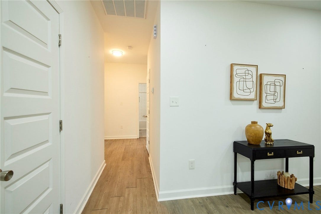 2421 Buena Vista Boulevard, Chester, VA 23831 White paneled interior door, wood-finish flooring, white walls, and recessed lighting