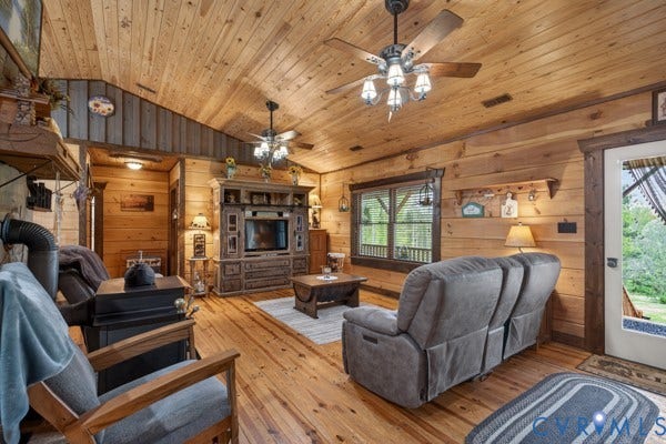 Natural wood paneling throughout, vaulted wood-finish ceilings, wood-finish flooring