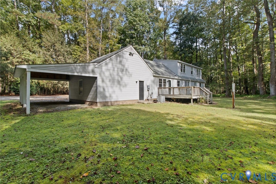 7847 Beaver Drive, All Others Area 20, Gloucester, VA 23061 Expansive lawn area with a multi-level structure featuring a full-width upper deck and an attached carport
