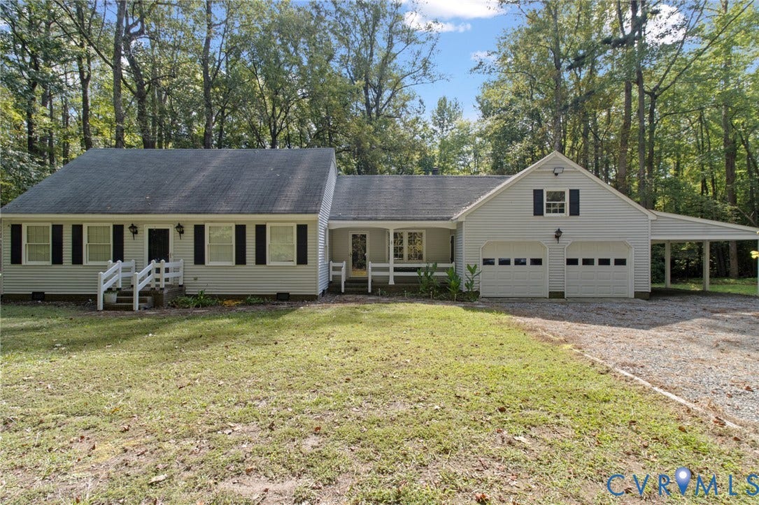 7847 Beaver Drive, All Others Area 20, Gloucester, VA 23061 Light-colored siding home featuring a two-car garage, attached carport, and covered entry porch