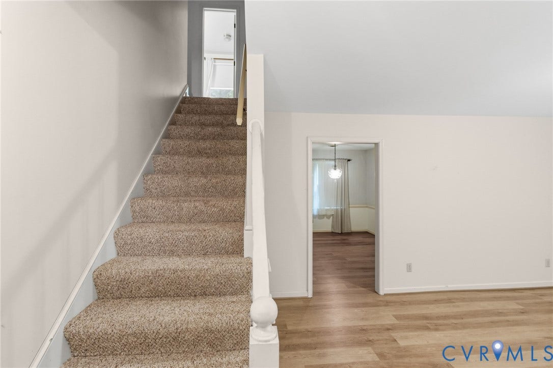7847 Beaver Drive, All Others Area 20, Gloucester, VA 23061 Carpeted staircase with white balusters, leading to an upper level