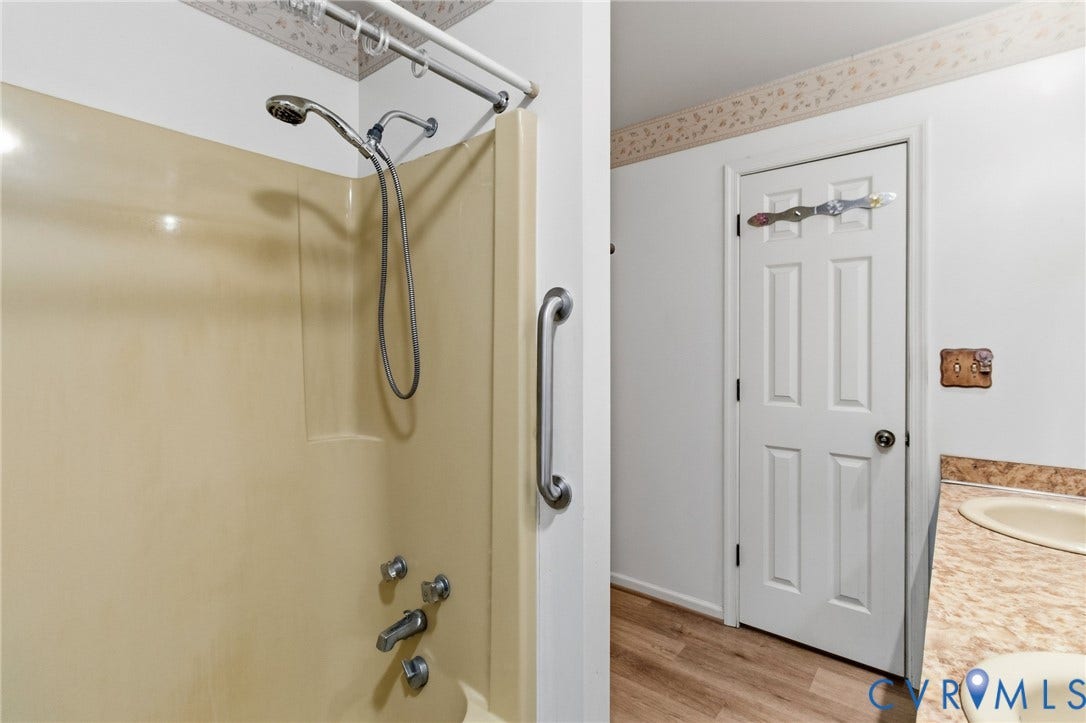 7847 Beaver Drive, All Others Area 20, Gloucester, VA 23061 Fiberglass shower enclosure with a handheld shower head, grab bar, and chrome fixtures