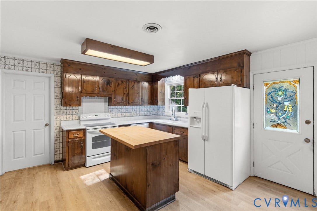 7847 Beaver Drive, All Others Area 20, Gloucester, VA 23061 Wood-finish flooring, wood cabinetry, white appliances, and a butcher block island