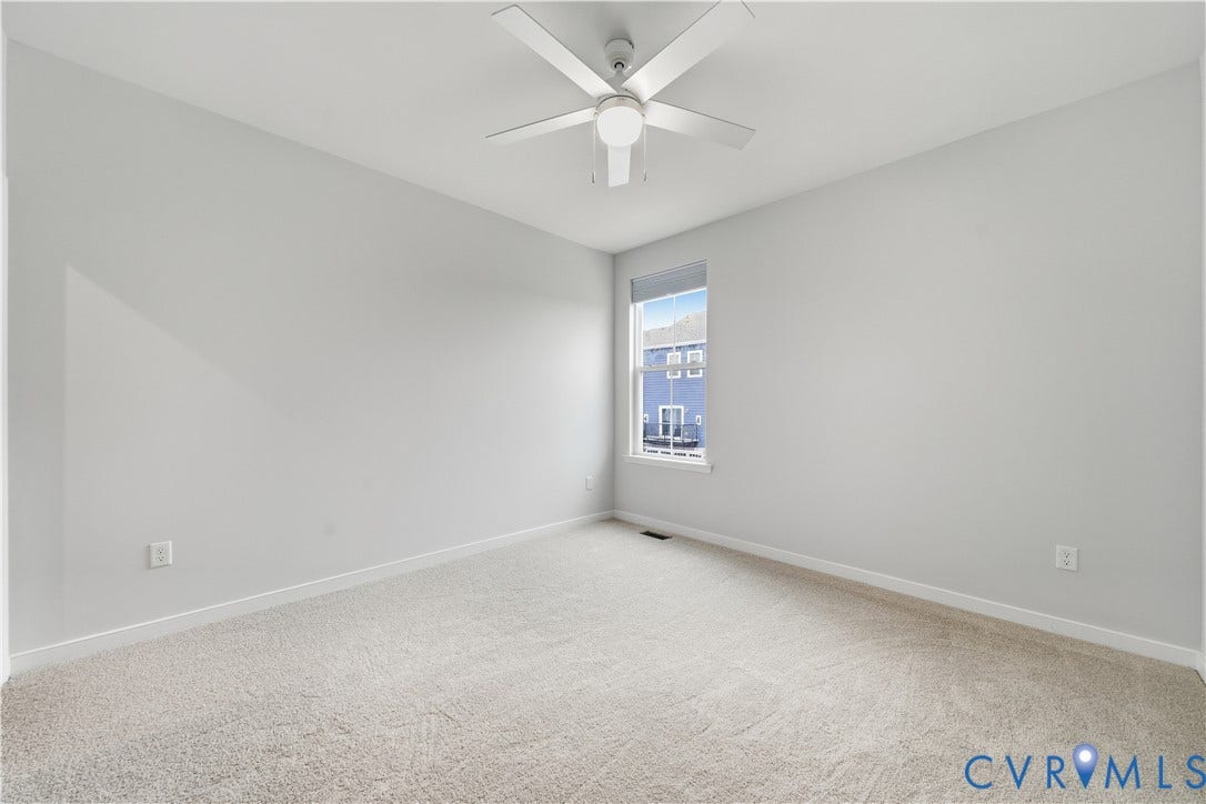 Secondary bedroom with new carpet.