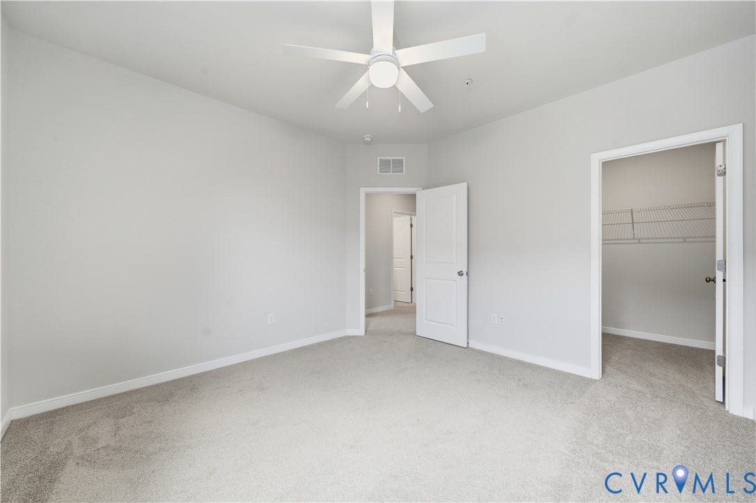 Bedroom with walk-in closet