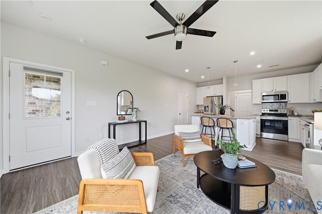 Comfortable living space with overhead fans and lights.