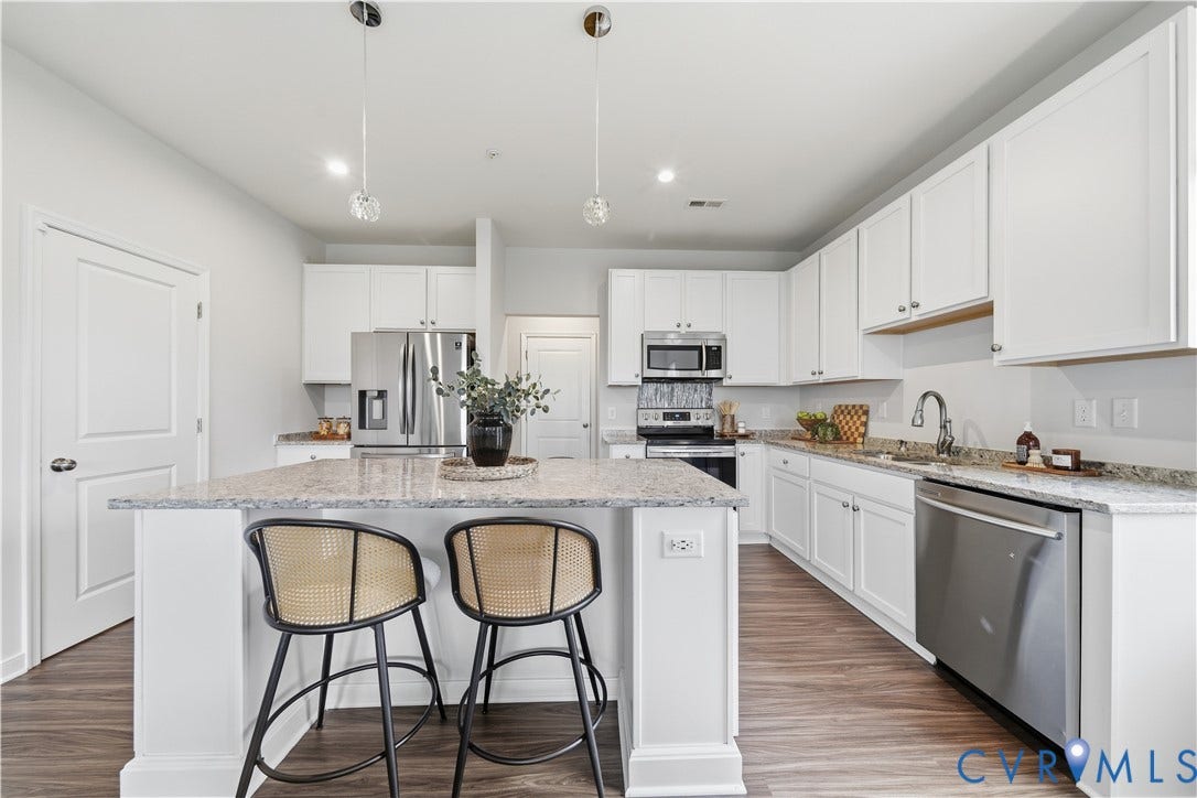 An eat-up island with space for 4 chairs.