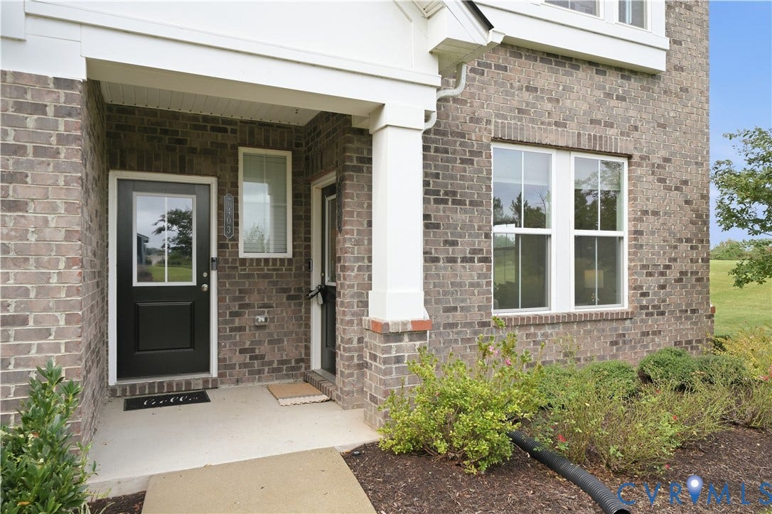 Windows to the courtyard and the open land to the side of the building.