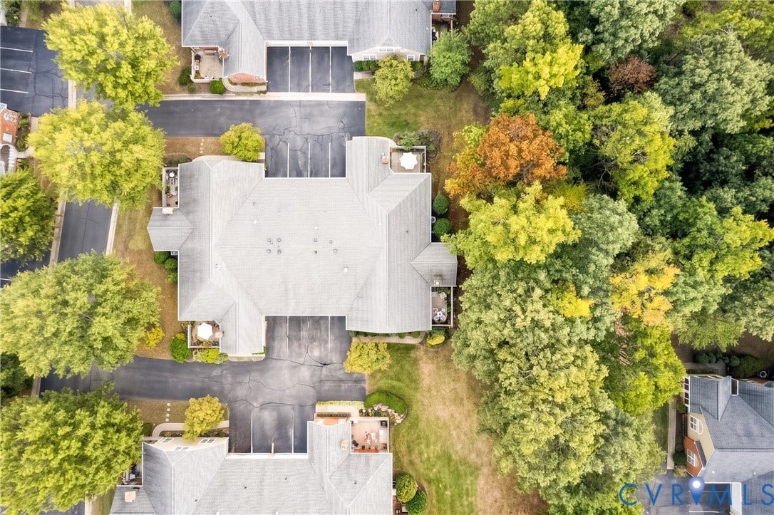 Paved parking areas, mature tree landscaping